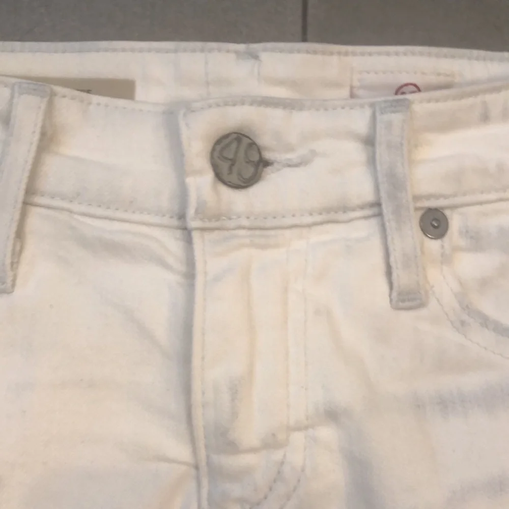 AG White Distressed Bonnie Cut Off Jean Shorts